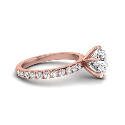 Round cut lab grown diamond solitaire engagement ring with pavé band in rose gold design.
