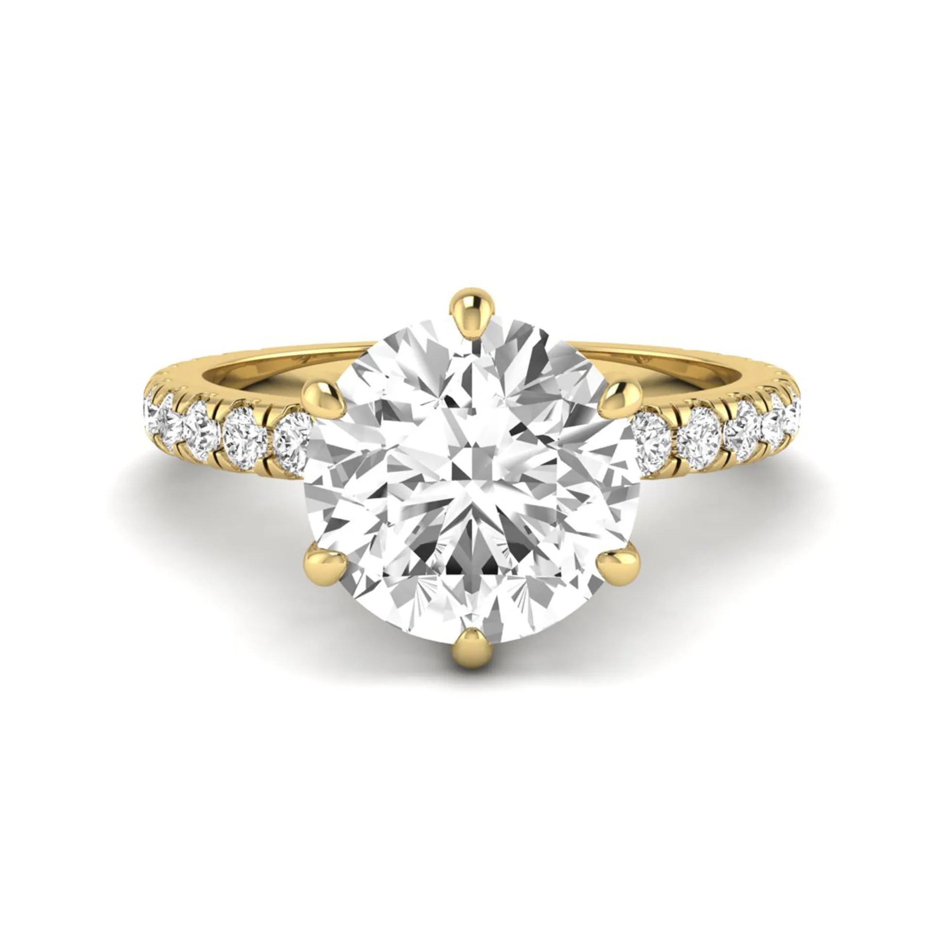 Round cut lab grown diamond solitaire engagement ring with pavé band in yellow gold design.