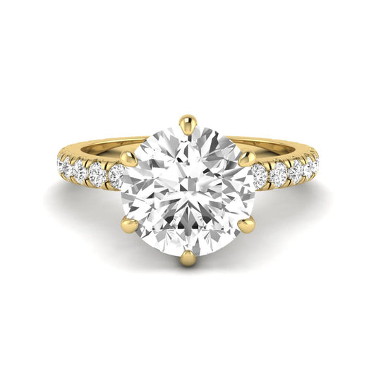 Round cut lab grown diamond solitaire engagement ring with pavé band in yellow gold design.