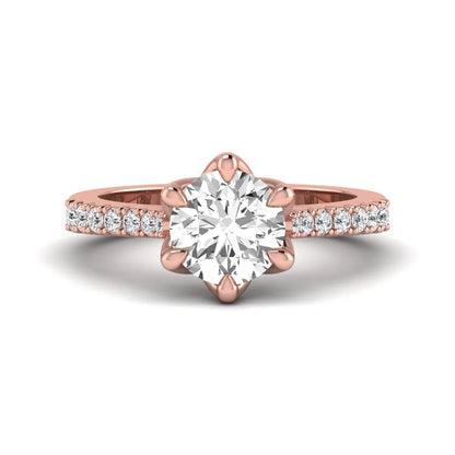Round solitaire pavé lab grown diamond engagement ring featuring a 2.43 carat round brilliant IGI certified center diamond with pavé accent diamonds on a rose gold band.