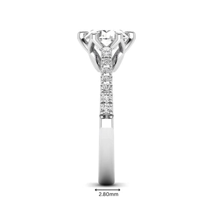 Round solitaire pavé lab grown diamond engagement ring featuring a 2.43 carat round brilliant IGI certified center diamond with pavé accent diamonds on a white gold band.