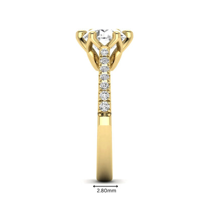 Round solitaire pavé lab grown diamond engagement ring featuring a 2.43 carat round brilliant IGI certified center diamond with pavé accent diamonds on a yellow gold band.