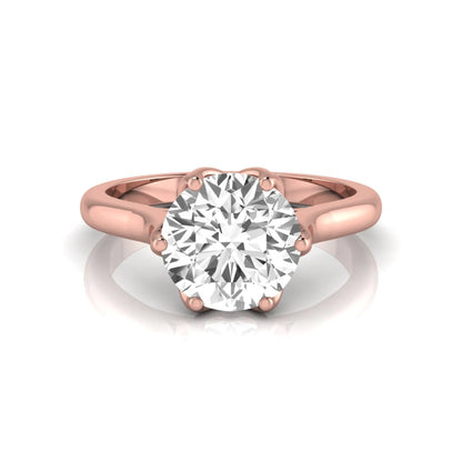 Round cut lab grown diamond solitaire engagement ring featuring a classic six-prong setting on a polished rose gold style band.