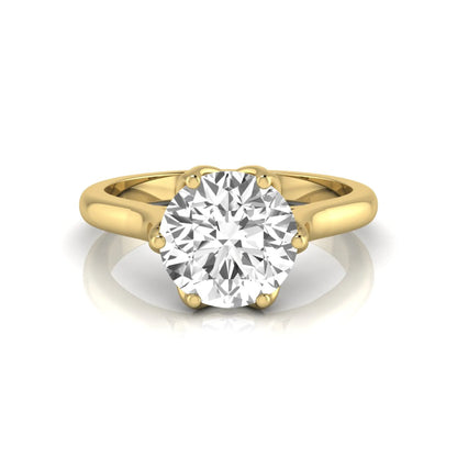 Round cut lab grown diamond solitaire engagement ring featuring a classic six-prong setting on a polished yellow gold style band.