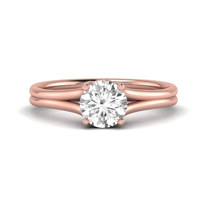 IGI certified 1.04 carat round cut lab grown diamond solitaire engagement ring with elegant split shank in rose gold.