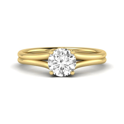 IGI certified 1.04 carat round cut lab grown diamond solitaire engagement ring with elegant split shank in yellow gold.