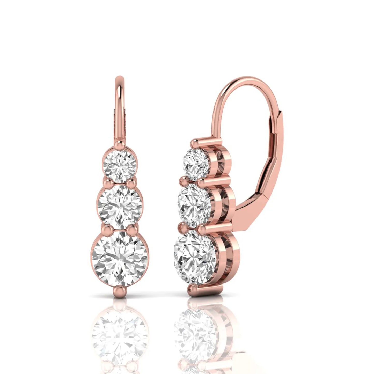 Round cut lab grown diamond graduated three stone drop earrings featuring a shared four-prong setting with secure lever back closure and rose gold tone design.