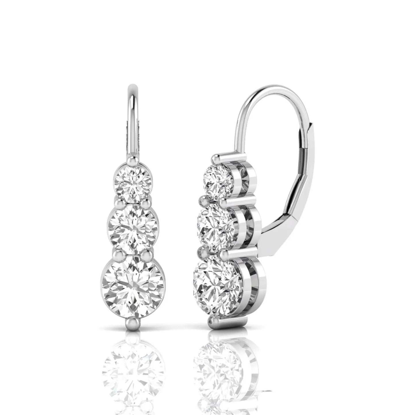 Round cut lab grown diamond graduated three stone drop earrings featuring a shared four-prong setting with secure lever back closure and white gold tone design.