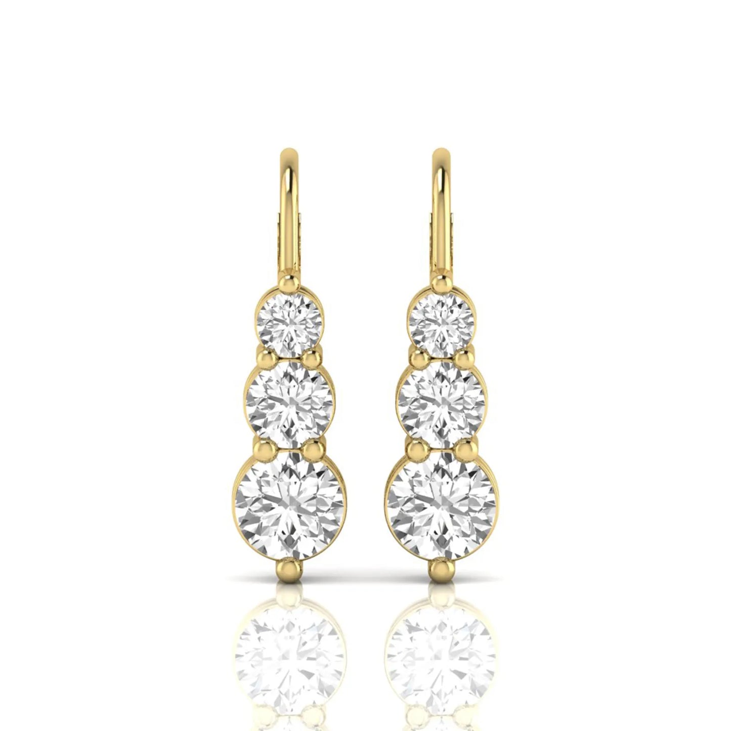 Round cut lab grown diamond graduated three stone drop earrings featuring a shared four-prong setting with secure lever back closure and yellow gold tone design.