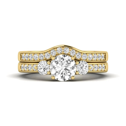 Round cut three stone lab grown diamond bridal ring set with matching diamond wedding band in yellow gold featuring a 1.03 carat IGI certified center diamond.