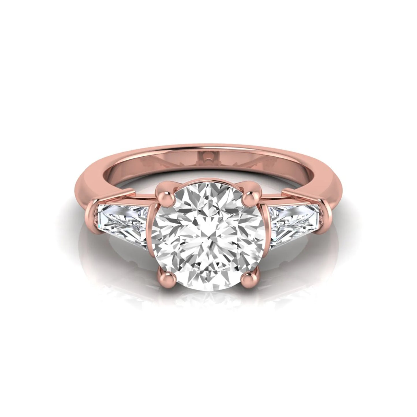 Round cut lab grown diamond three-stone engagement ring featuring tapered baguette side diamonds in a classic four-prong rose gold setting.