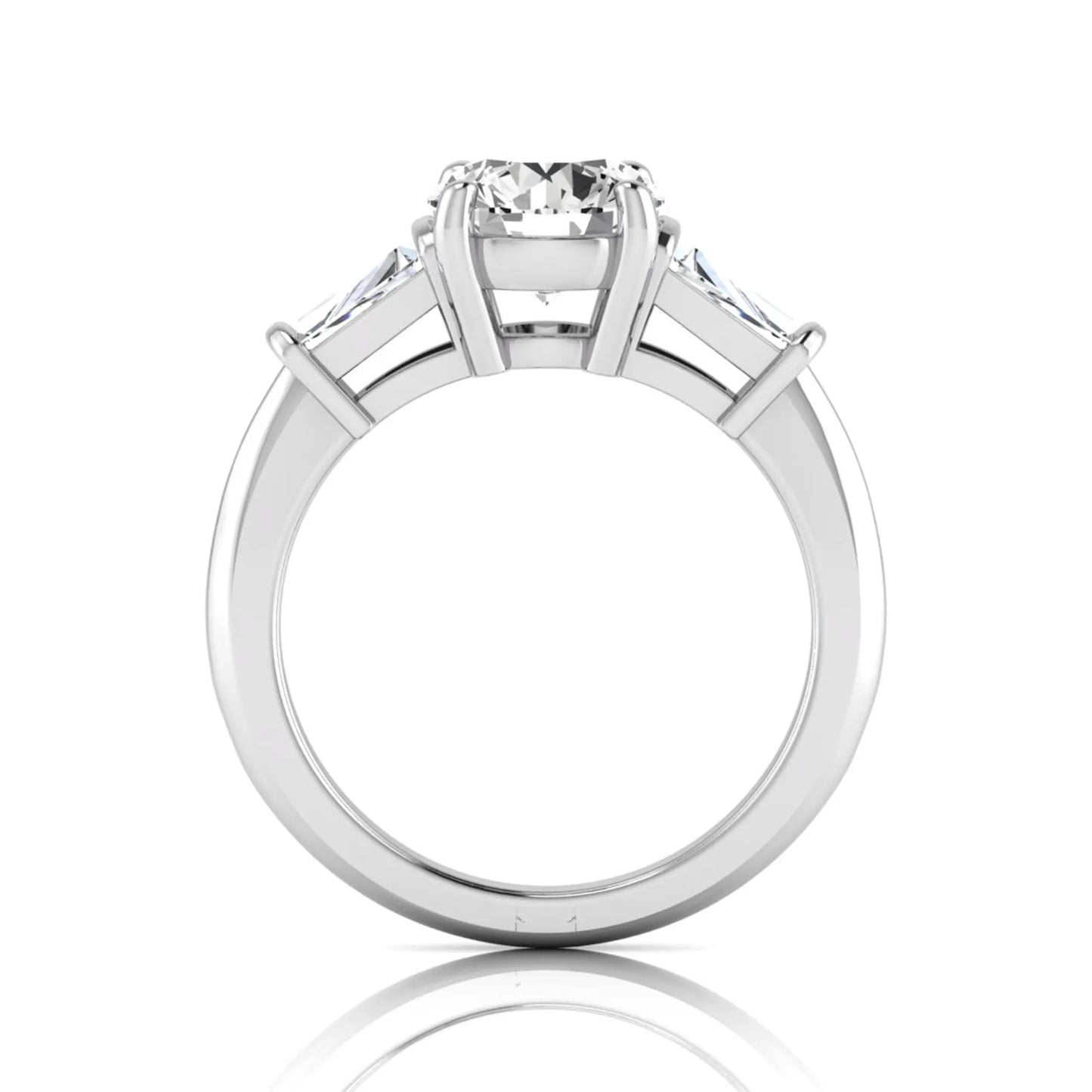 Round cut lab grown diamond three-stone engagement ring featuring tapered baguette side diamonds in a classic four-prong white gold setting.