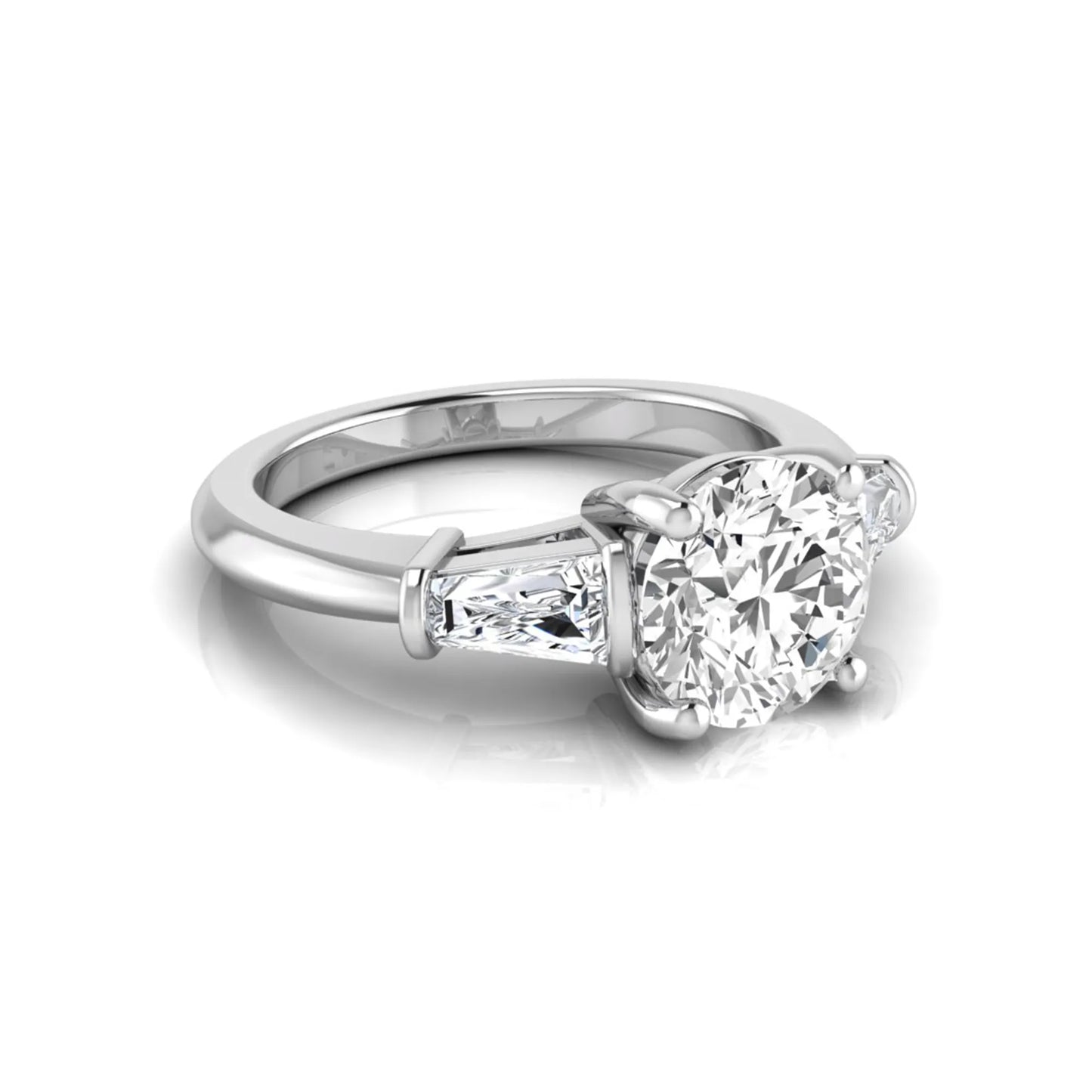 Round cut lab grown diamond three-stone engagement ring featuring tapered baguette side diamonds in a classic four-prong white gold setting.