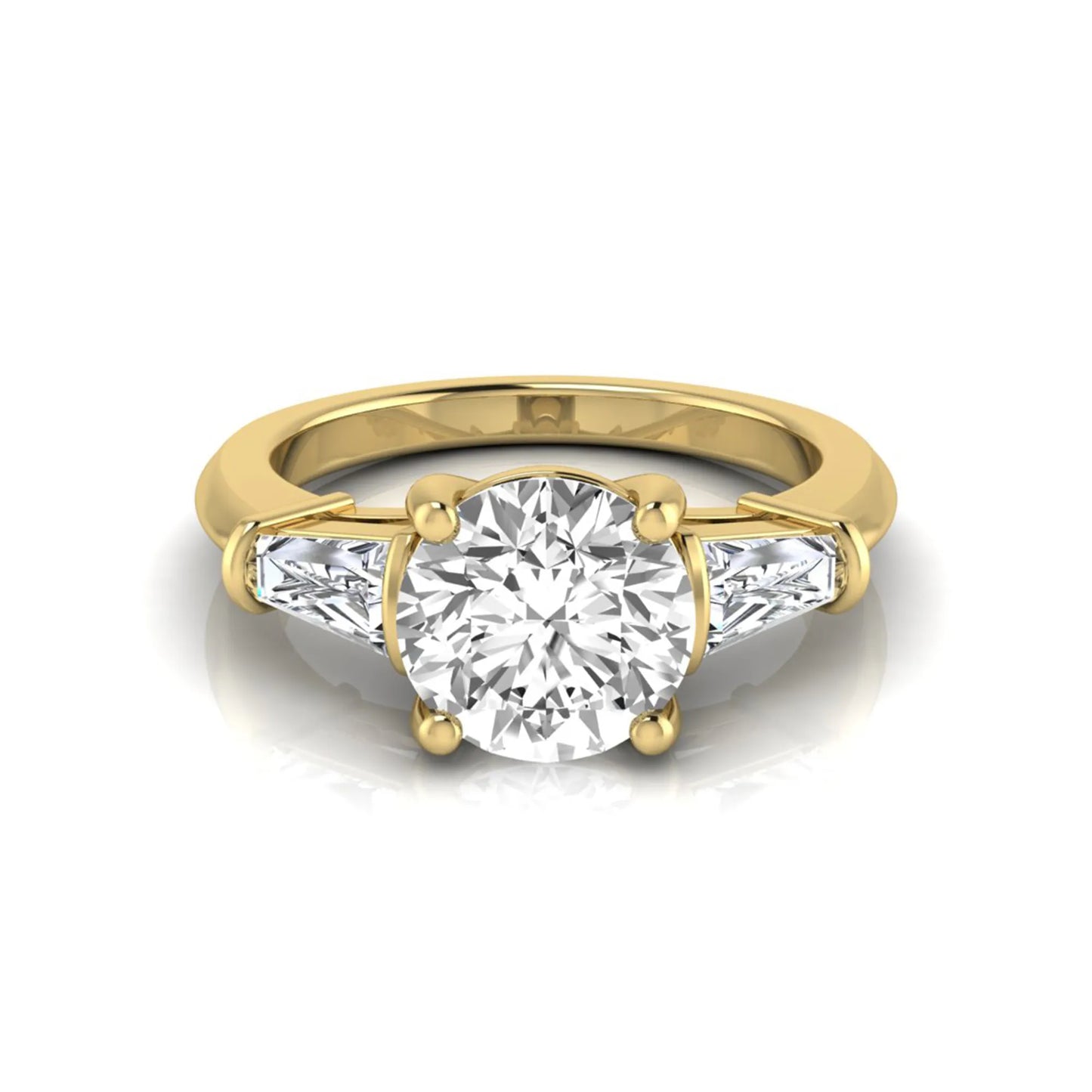 Round cut lab grown diamond three-stone engagement ring featuring tapered baguette side diamonds in a classic four-prong yellow gold setting.