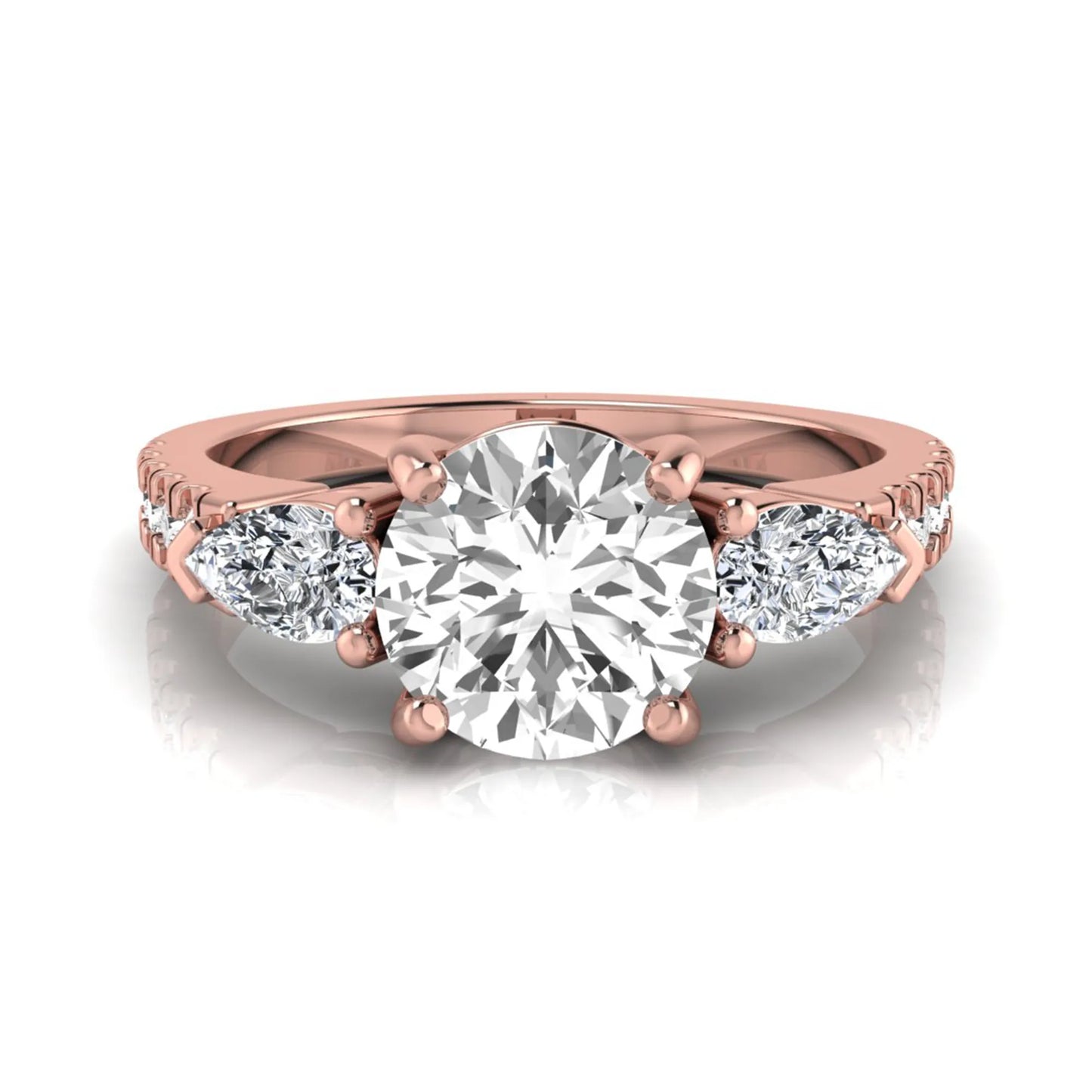 Round cut lab grown diamond three stone engagement ring featuring a 1.28 carat IGI certified center diamond with pear and round side diamonds on a pavé rose gold band.