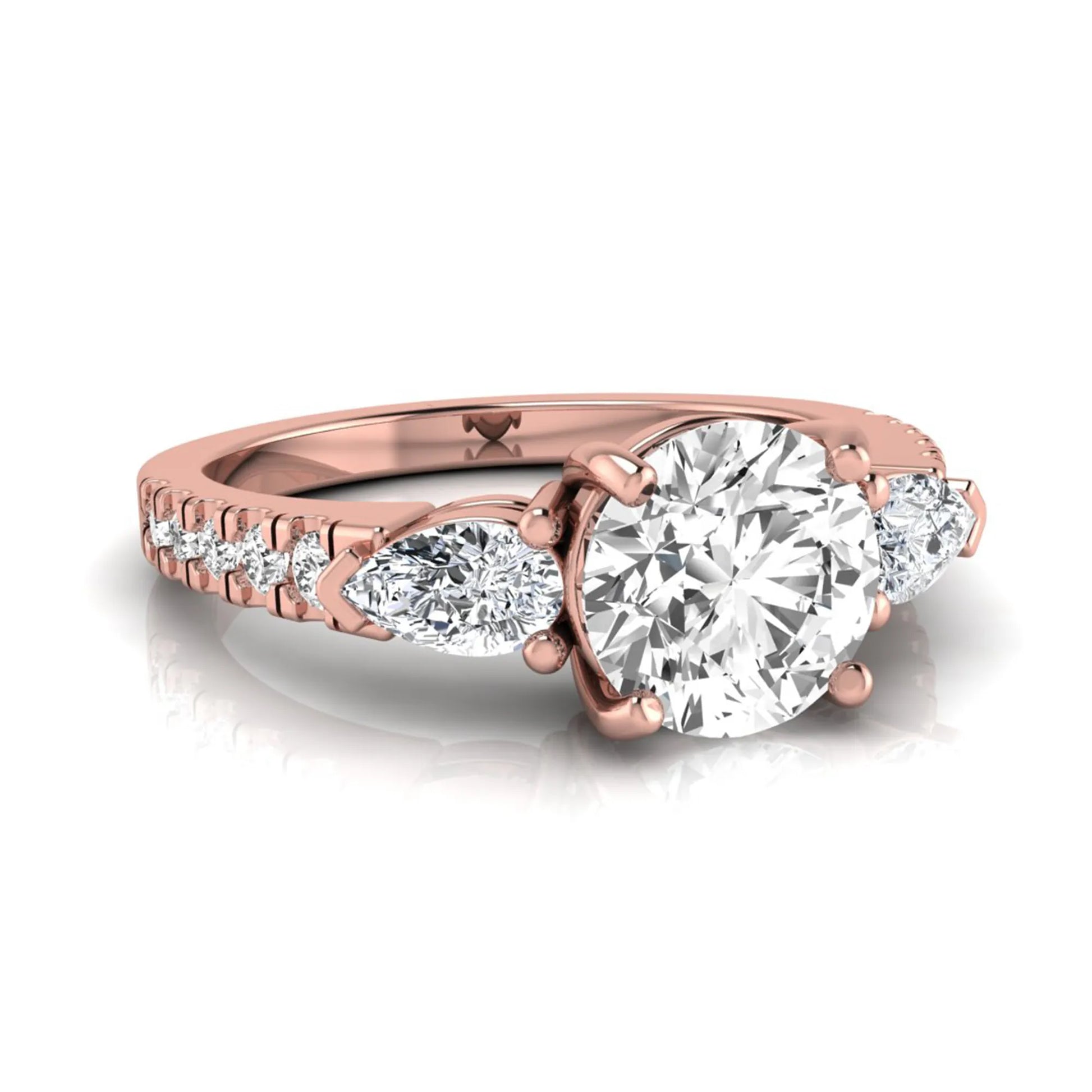 Round cut lab grown diamond three stone engagement ring featuring a 1.28 carat IGI certified center diamond with pear and round side diamonds on a pavé rose gold band.