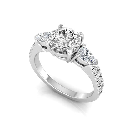 Round cut lab grown diamond three stone engagement ring featuring a 1.28 carat IGI certified center diamond with pear and round side diamonds on a pavé white gold band.