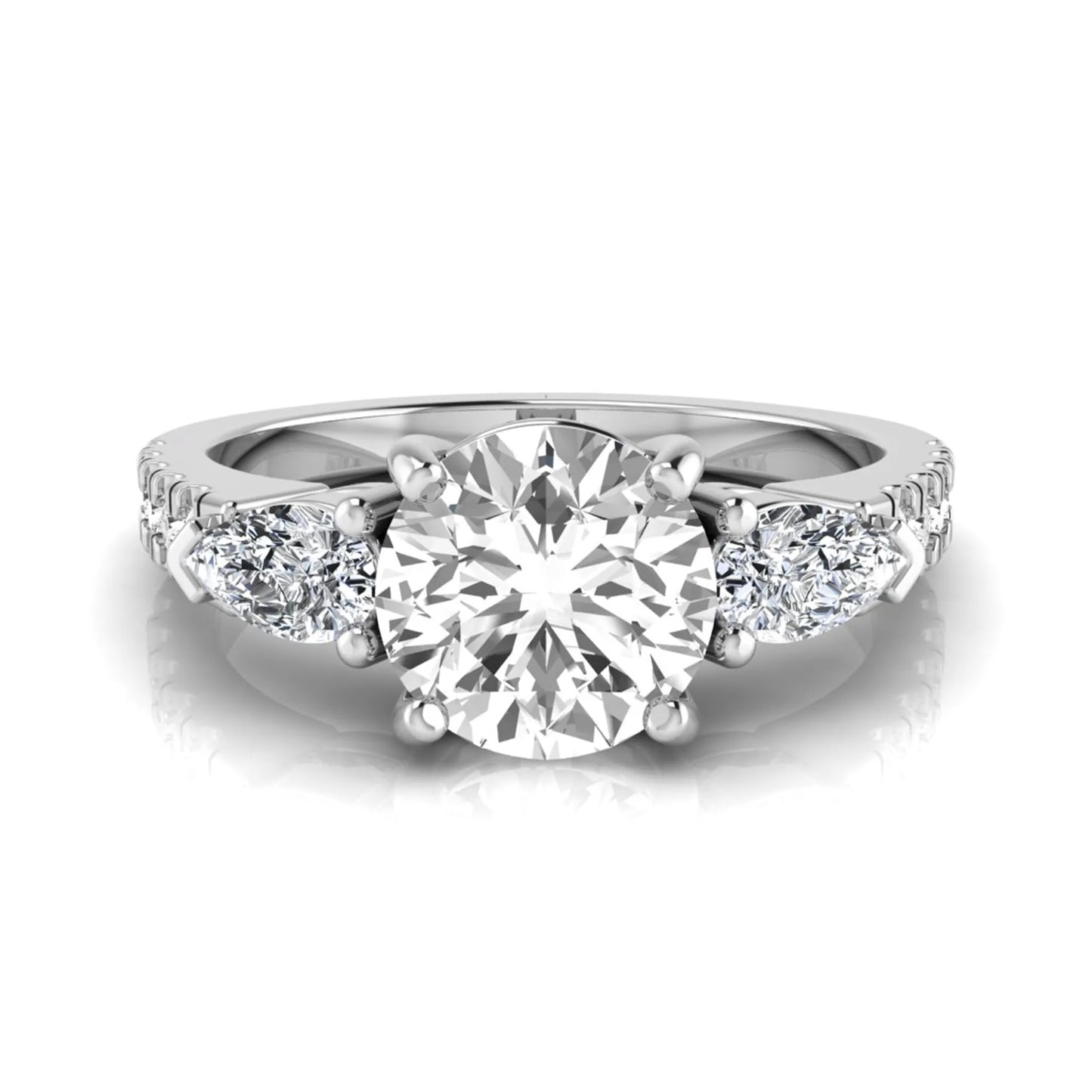 Round cut lab grown diamond three stone engagement ring featuring a 1.28 carat IGI certified center diamond with pear and round side diamonds on a pavé white gold band.