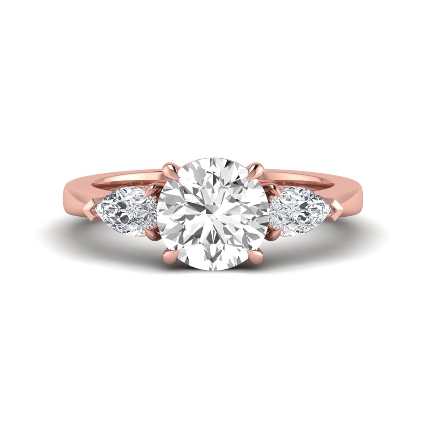 Round three stone prong set lab grown diamond engagement ring featuring a 2.00 carat round center diamond with pear cut side diamonds in rose gold finish.