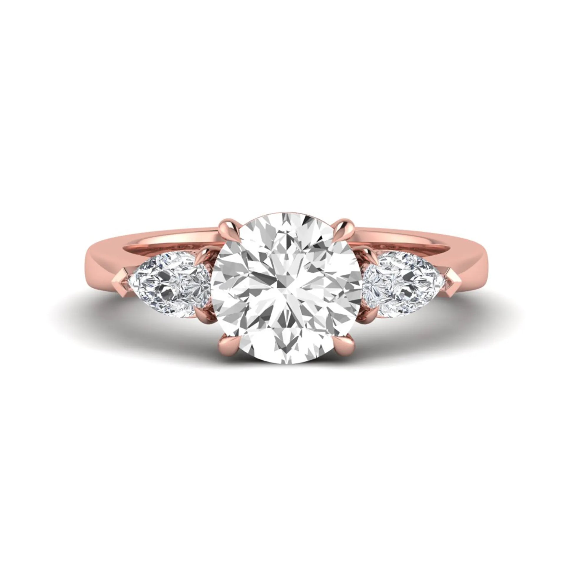 Round three stone prong set lab grown diamond engagement ring featuring a 2.00 carat round center diamond with pear cut side diamonds in rose gold finish.