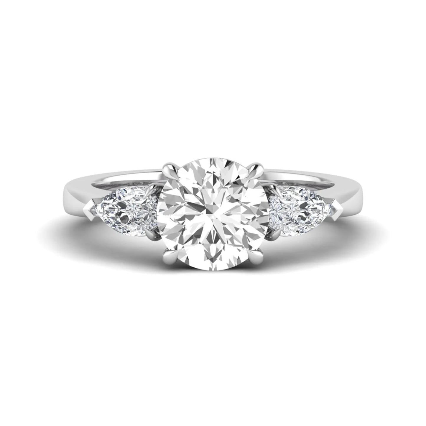 Round three stone prong set lab grown diamond engagement ring featuring a 2.00 carat round center diamond with pear cut side diamonds in white gold finish.