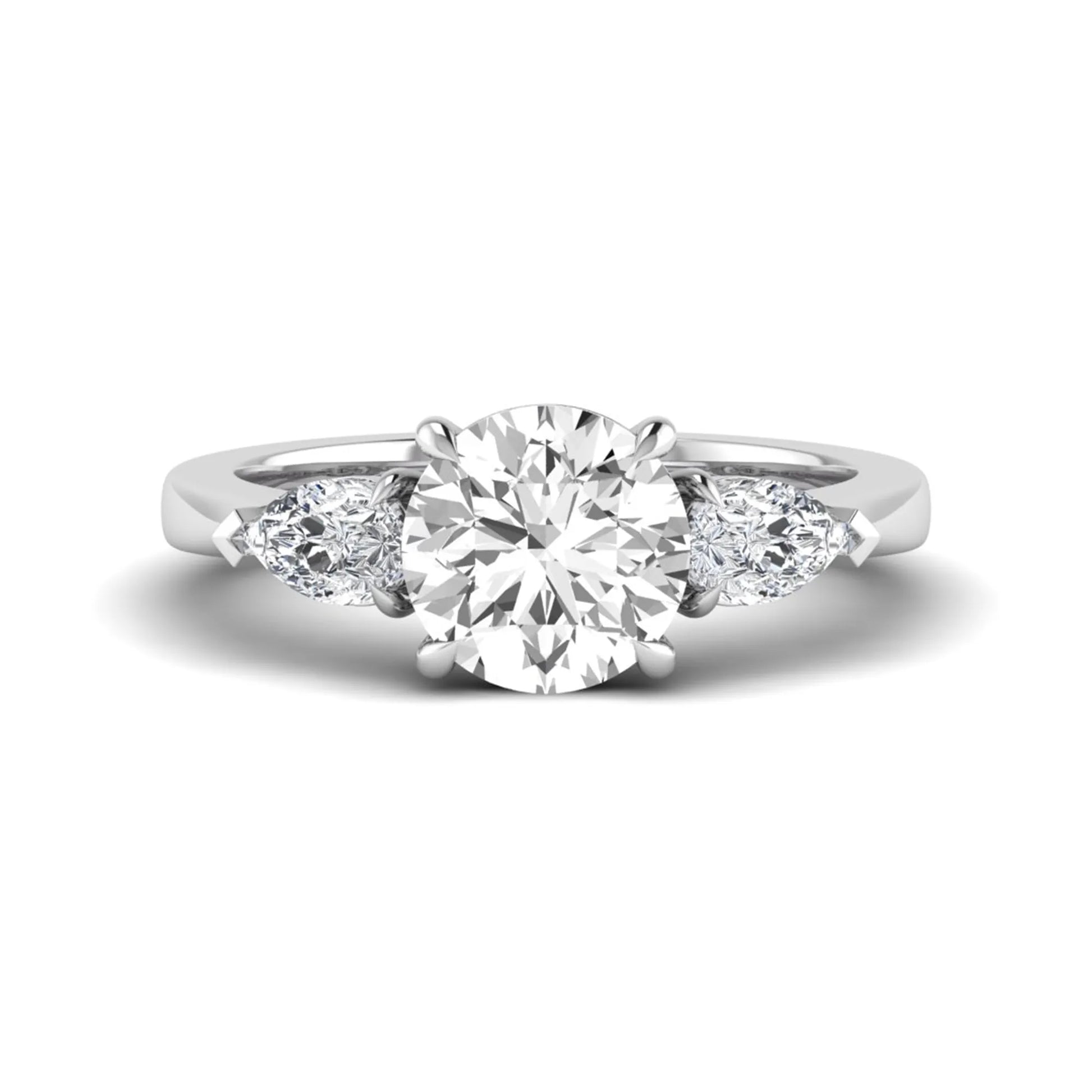 Round three stone prong set lab grown diamond engagement ring featuring a 2.00 carat round center diamond with pear cut side diamonds in white gold finish.