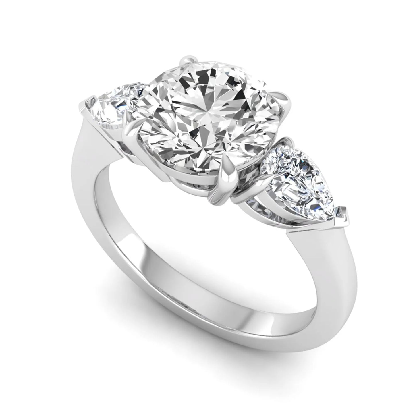Round three stone prong set lab grown diamond engagement ring featuring a 2.00 carat round center diamond with pear cut side diamonds in white gold finish.