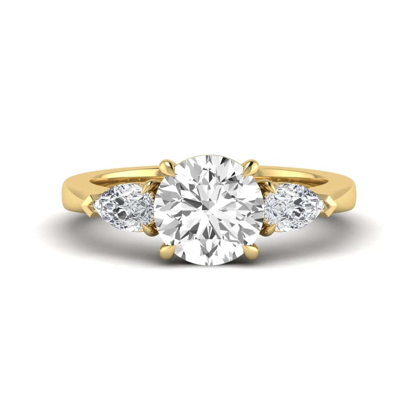 Round three stone prong set lab grown diamond engagement ring featuring a 2.00 carat round center diamond with pear cut side diamonds in yellow gold finish.