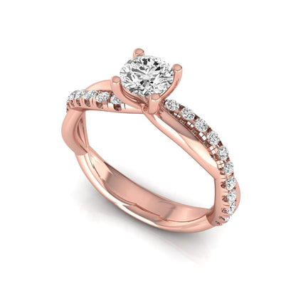 Round twist pavé lab grown diamond solitaire engagement ring featuring a 0.60 carat round cut center diamond with pavé diamond crossover band in a rose gold design.