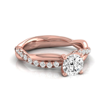 Round twist pavé lab grown diamond solitaire engagement ring featuring a 0.60 carat round cut center diamond with pavé diamond crossover band in a rose gold design.