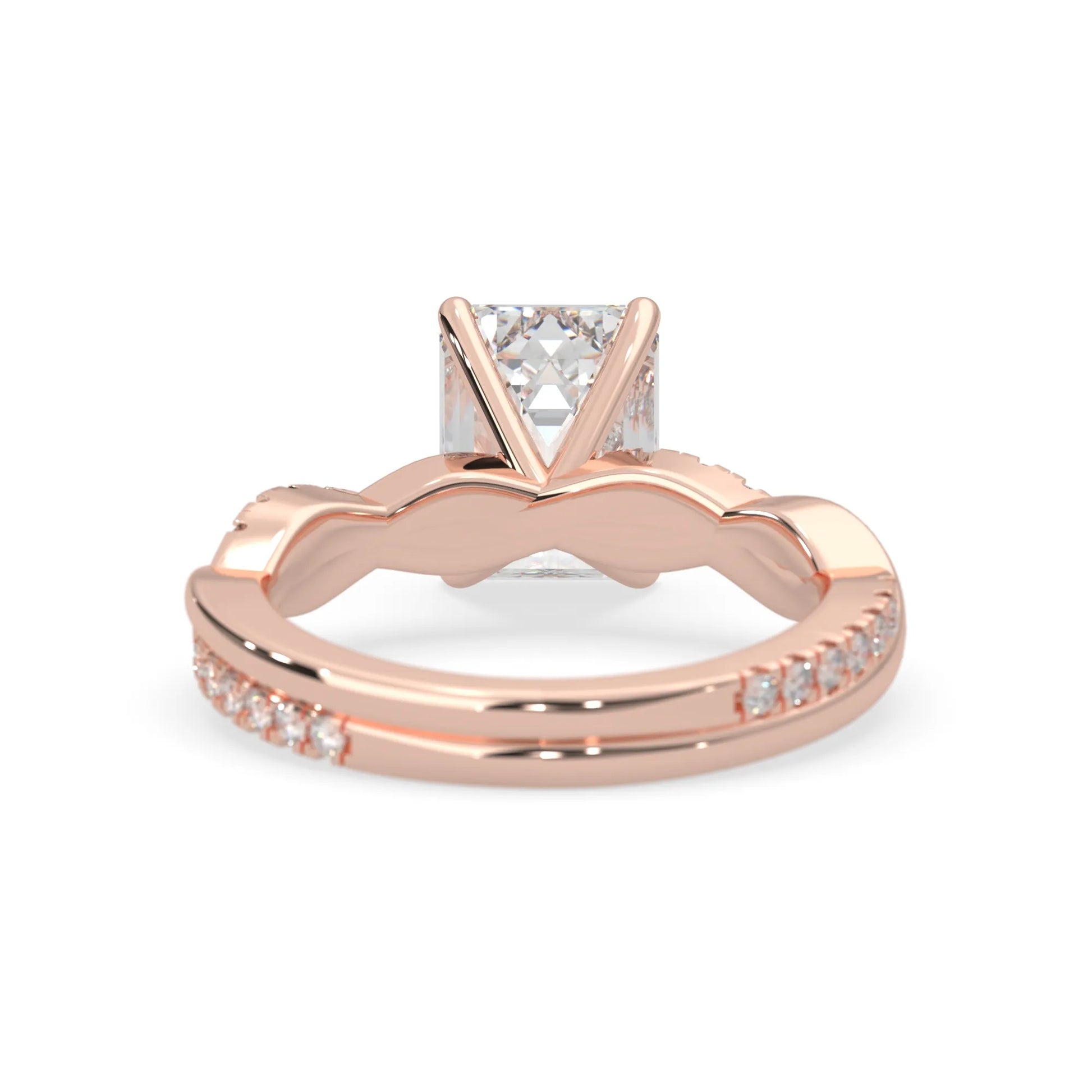 Emerald brilliant lab grown diamond engagement ring with prong setting and twisted pavé diamond band in rose gold tone