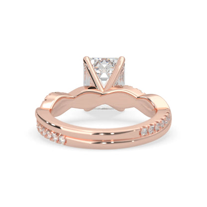 Emerald brilliant lab grown diamond engagement ring with prong setting and twisted pavé diamond band in rose gold tone