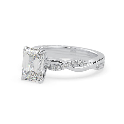 Emerald brilliant lab grown diamond engagement ring with prong setting and twisted pavé diamond band in white gold tone
