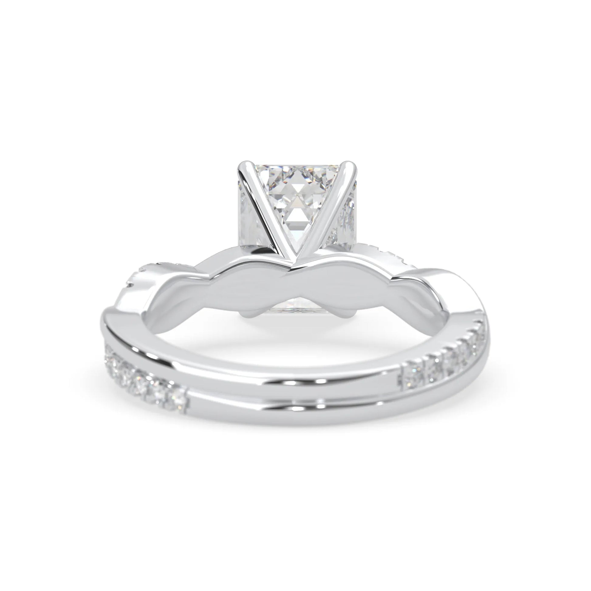 Emerald brilliant lab grown diamond engagement ring with prong setting and twisted pavé diamond band in white gold tone