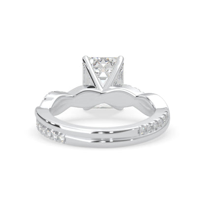 Emerald brilliant lab grown diamond engagement ring with prong setting and twisted pavé diamond band in white gold tone