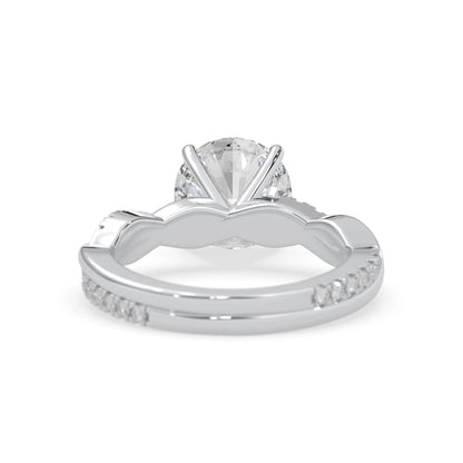 Round brilliant lab grown diamond engagement ring with prong setting and twisted pavé diamond band in white gold tone