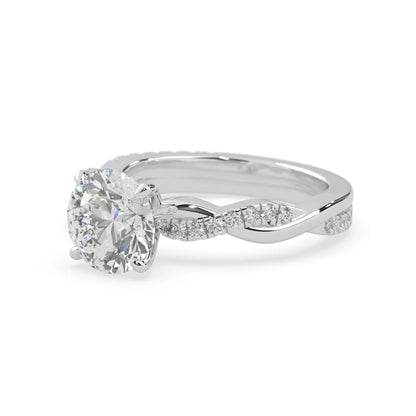 Round brilliant lab grown diamond engagement ring with prong setting and twisted pavé diamond band in white gold tone