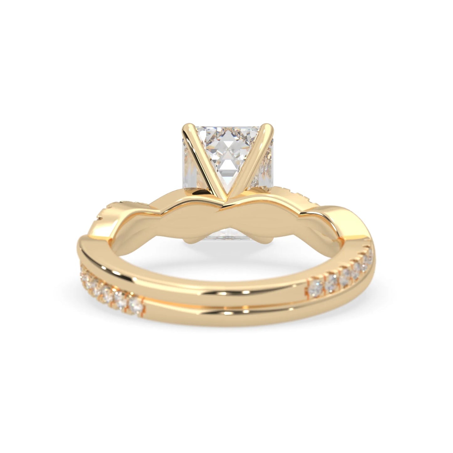 Emerald brilliant lab grown diamond engagement ring with prong setting and twisted pavé diamond band in yellow gold tone