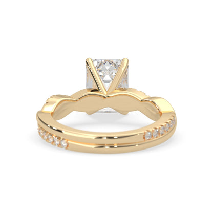 Emerald brilliant lab grown diamond engagement ring with prong setting and twisted pavé diamond band in yellow gold tone