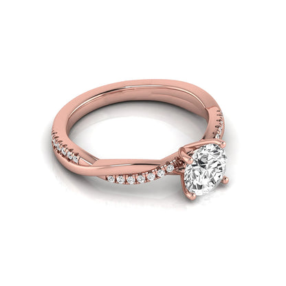 Round cut lab grown diamond engagement ring featuring a twisted pavé shank with a four-prong solitaire setting and polished rose gold tone band.