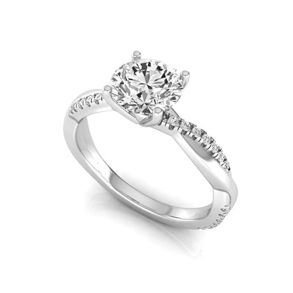 Round cut lab grown diamond engagement ring featuring a twisted pavé shank with a four-prong solitaire setting and polished white gold tone band.