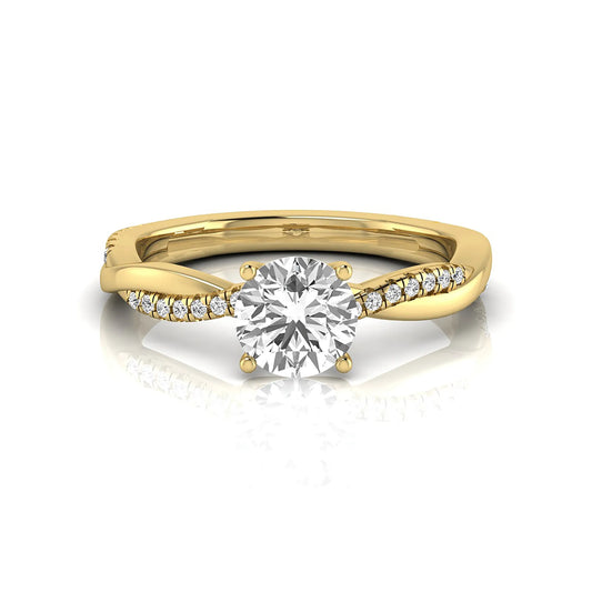 Round cut lab grown diamond engagement ring featuring a twisted pavé shank with a four-prong solitaire setting and polished yellow gold tone band.