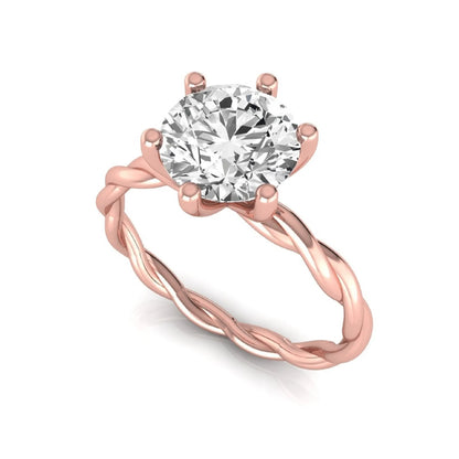 Round cut lab grown diamond engagement ring featuring a 1.28 carat center diamond in a six-prong solitaire setting with an elegant twisted rope band and polished rose gold finish.