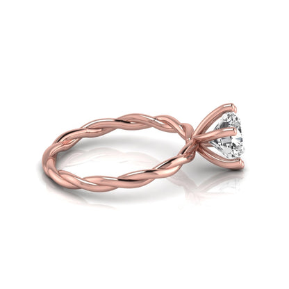 Round cut lab grown diamond engagement ring featuring a 1.28 carat center diamond in a six-prong solitaire setting with an elegant twisted rope band and polished rose gold finish.
