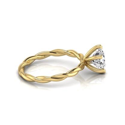 Round cut lab grown diamond engagement ring featuring a 1.28 carat center diamond in a six-prong solitaire setting with an elegant twisted rope band and polished yellow gold finish.