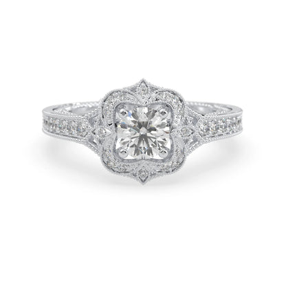 Round vintage halo lab grown diamond pave engagement ring with ornate gold setting and sparkling side diamonds in white gold