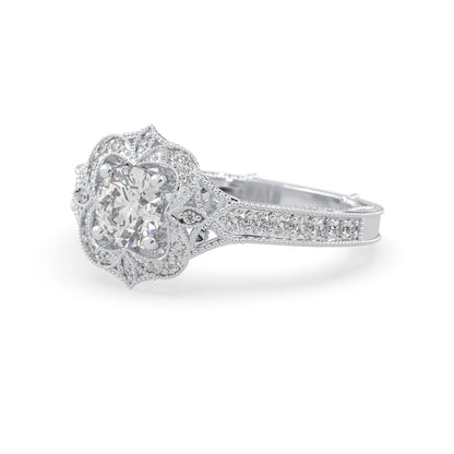Round vintage halo lab grown diamond pave engagement ring with ornate gold setting and sparkling side diamonds in white gold