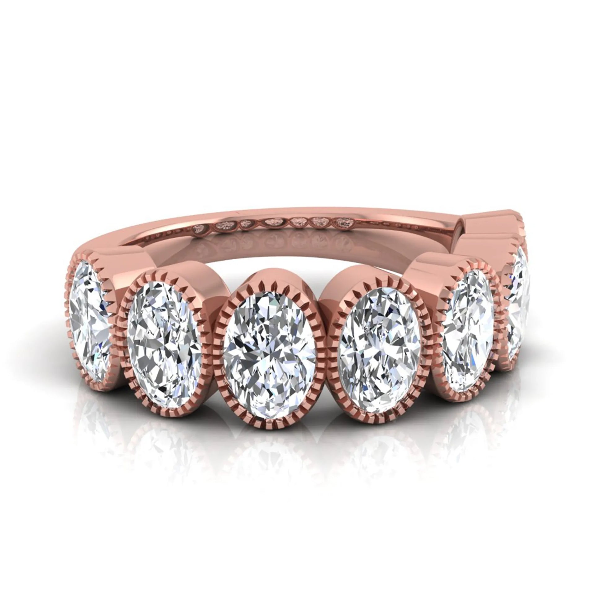 Seven Stone Oval Cut Lab Grown Diamond Band Ring featuring seven oval cut diamonds in elegant milgrain bezel-inspired settings with a rose gold tone band.