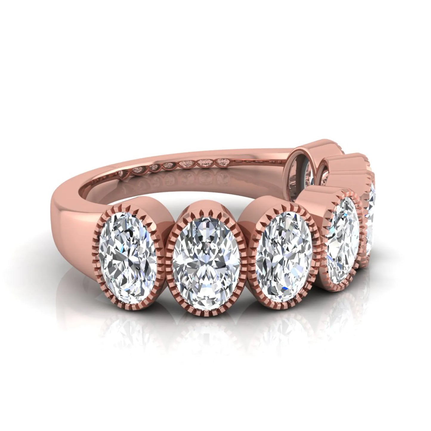 Seven Stone Oval Cut Lab Grown Diamond Band Ring featuring seven oval cut diamonds in elegant milgrain bezel-inspired settings with a rose gold tone band.