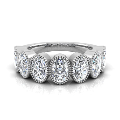 Seven Stone Oval Cut Lab Grown Diamond Band Ring featuring seven oval cut diamonds in elegant milgrain bezel-inspired settings with a white gold tone band.